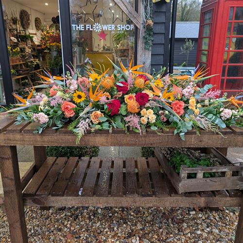 Colourful casket spray with Birds of paradise